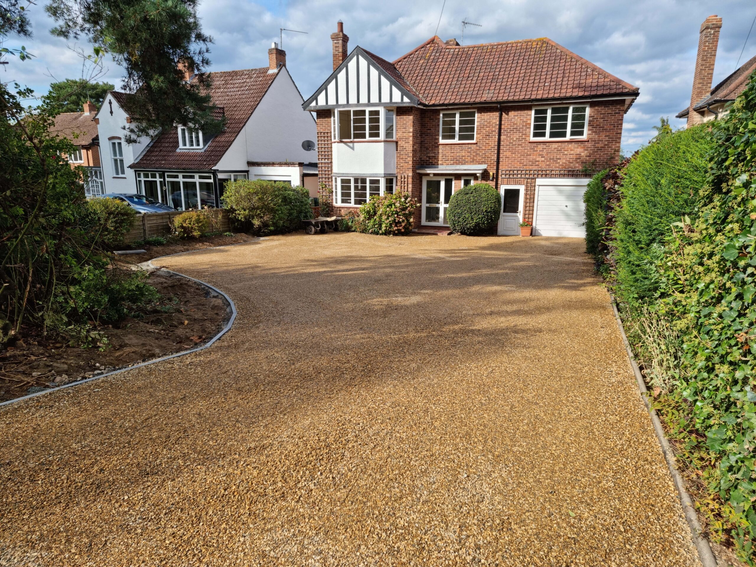 This is a newly installed tar and chip driveway installed by Mundford Driveways