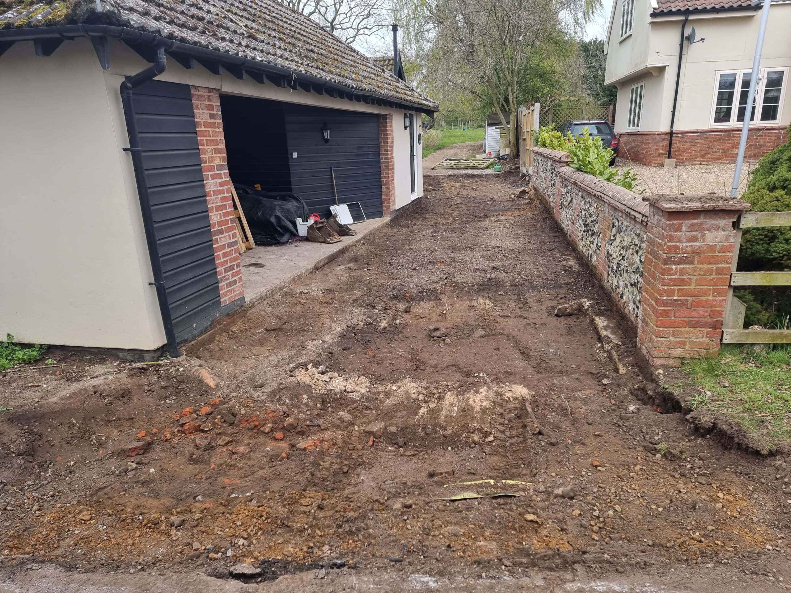 This is a tarmac driveway that is in the process of being dug out and installed by Mundford Driveways